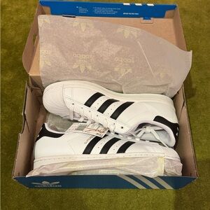 Brand new Adidas white superstars